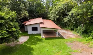 New house with a large plot of land, surrounded by